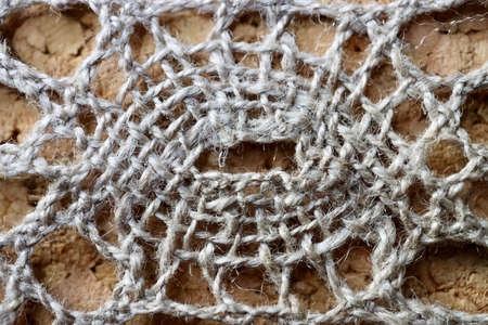 Natural fibre linen lace, macro close up of central detail of a patternの写真素材