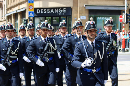 Police officers marching on National day parade. Luxembourg, Luxembourg - June 23, 2022. Selective...