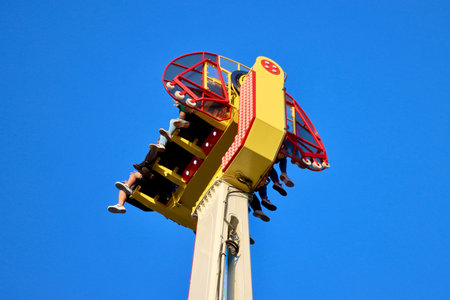 Magic carpet thrill ride with people in Schueberfouer fun fair in Luxembourg, Luxembourg - August 28, 2022のeditorial素材