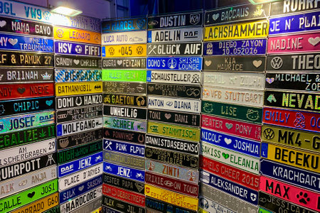 Print on order colourful plaques with any name customer wants, resembling car number plates. Luxembourg, Luxembourg - August 28, 2022のeditorial素材