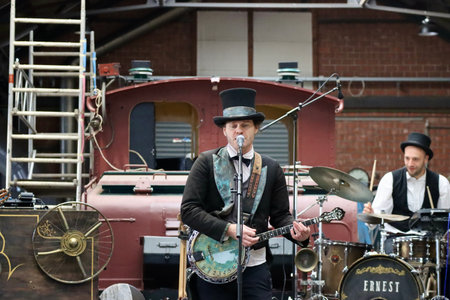Band of steampunk style musicians Les Gavroches playing traditional songs in open air setting. Fond-de-Gras, Luxembourg - September 25, 2022のeditorial素材