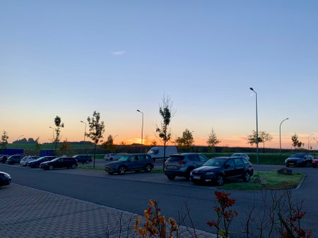 Park and ride with some cars in sunrise. Junglinster, Luxembourg - October 7, 2022のeditorial素材
