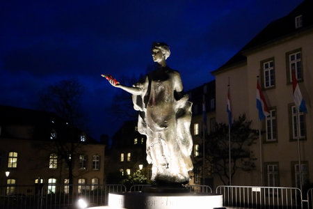 Bronze statue of Grand Duchess Charlotte with temporary added Christmas present in her hand. Author French sculptor Jean Cardot. Luxembourg, Luxembourg - December 27, 2022のeditorial素材