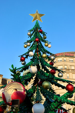 Carousel in a shape of a Christmas tree, big lower baubles are the carousel cars. Luxembourg, Luxembourg - December 17, 2022のeditorial素材