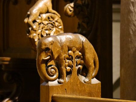 Traditional wood carvings in the interior decorations of Basilica of St. Willibrord: Elephant and tree. Echternach, Luxembourg - April 10, 2023のeditorial素材