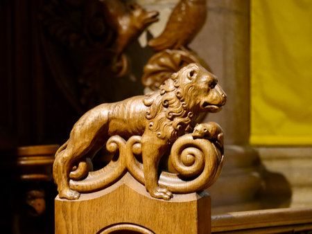 Traditional wood carvings in the interior decorations of Basilica of St. Willibrord: Lion and mouse. Echternach, Luxembourg - April 10, 2023のeditorial素材