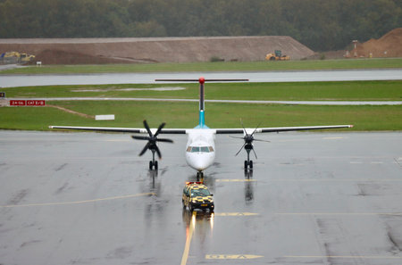 Luxair De Havilland Canada Dash 8-400 in Luxembourg airport. Findel, Luxembourg - October 2, 2022のeditorial素材