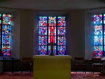 Stained glass windows with modern religious art in cript under Cathedral. Luxembourg, Luxembourg - September 24, 2023のeditorial素材