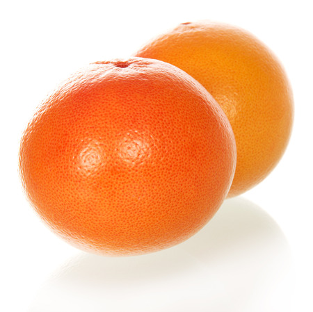 Two grapefruits isolated on the whiteの写真素材