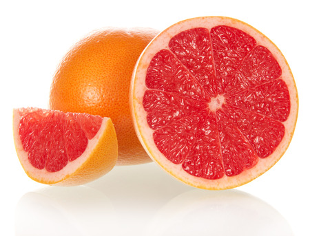 Grapefruit in a section isolated on the whiteの写真素材