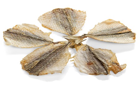 Dried salty fishes, snack to beer, isolated on whiteの写真素材