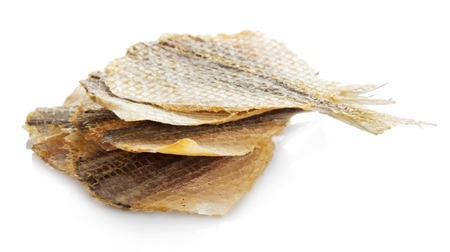 Dried salted fish for beer isolated on whiteの写真素材