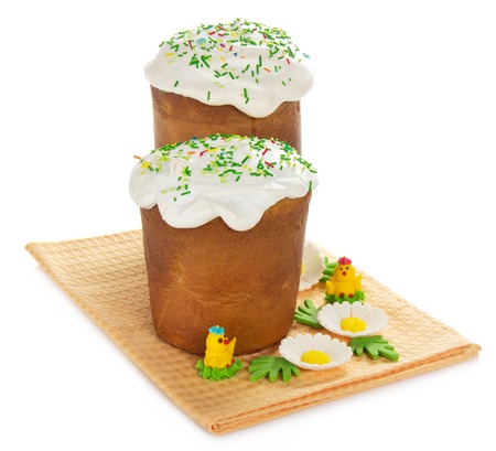 Easter cake and marzipan decor on a napkin, isolated on whiteの写真素材