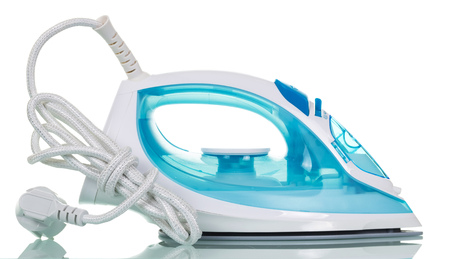 Modern steam iron close-up isolated on white background.の写真素材