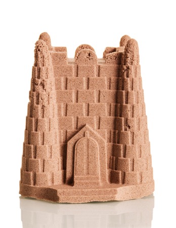 Sand Tower from the kinetic sand isolated on white background.の写真素材