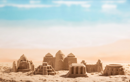Sand castles, towers and Coliseum on the background of the sea.の写真素材