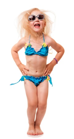 Little blond girl in a bathing suit and sunglasses screaming isolated on white background.の写真素材