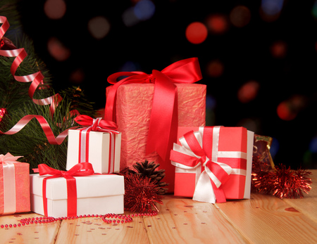 Christmas tree and many gifts on abstract dark background.の写真素材