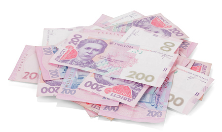 Pile of Ukrainian money in denomination of 200 UAH. isolated on white background.の写真素材