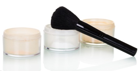 Cosmetic brush and jars with powder isolated on white background.の写真素材