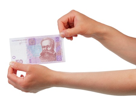 Ukrainian hryvnia 50 Money in female hands isolated on white background.