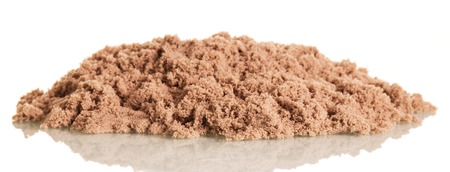 Kinetic sand in a pile closeup isolated on white background.の写真素材
