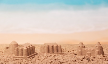 Sandcastles close up on a background of the sea.の写真素材