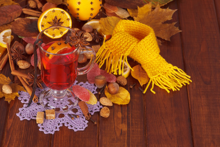 Mulled wine, nuts and sweets on a background of dark wood.の写真素材