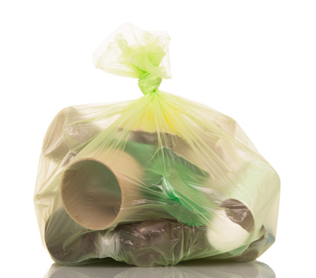 Full garbage bag with household waste isolated on white background.の写真素材