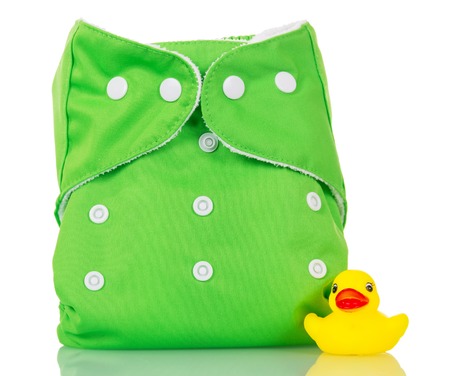 Modern cloth diapers and rubber duck isolated on white background.の写真素材