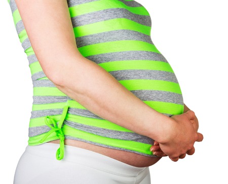 Pregnant woman, hands on her belly isolated on white background.
