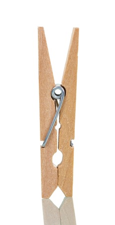 Wooden clothespin close-up isolated on white background.の写真素材