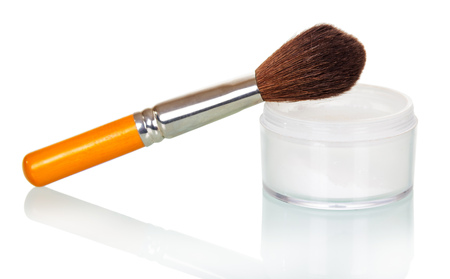 Professional cosmetics, makeup brush and a jar of cream isolated on white background.の写真素材