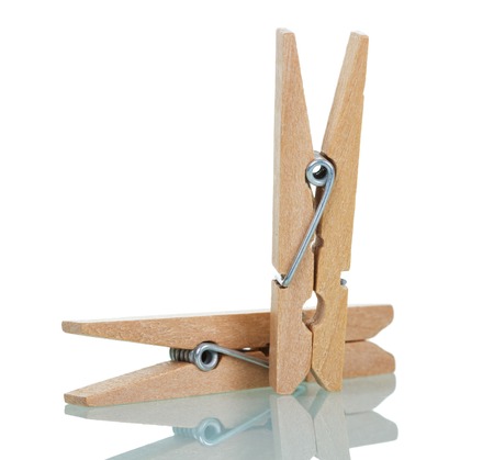 Two wooden clothespins isolated on white background.