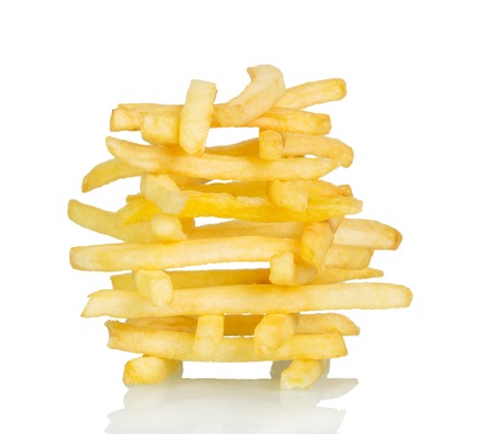 Crispy French fries isolated on white background.