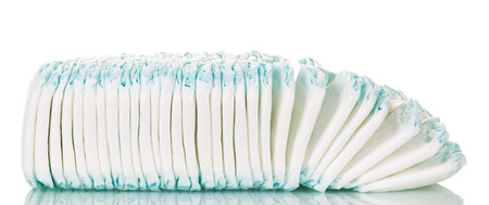 A stack of children's diapers isolated on white background.の写真素材