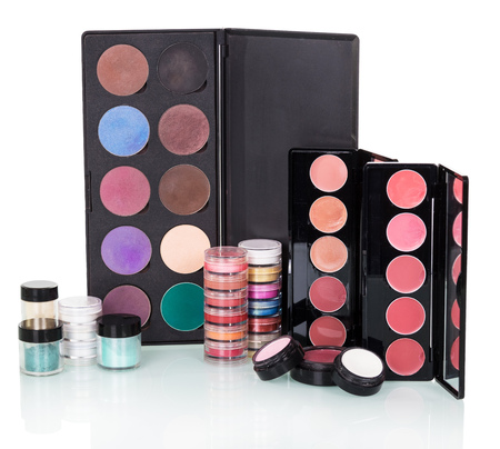 Sets of eye shadow, lip gloss, blush and powder isolated on white background.の写真素材