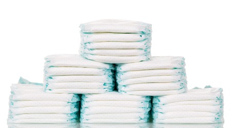 Stacks of diapers isolated on white background.の写真素材