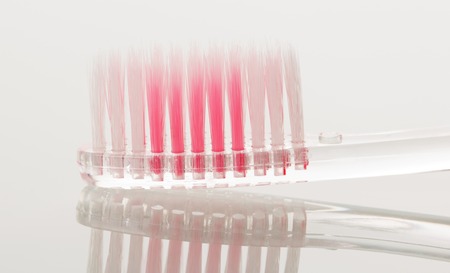 New toothbrush close-up isolated on white background.の写真素材