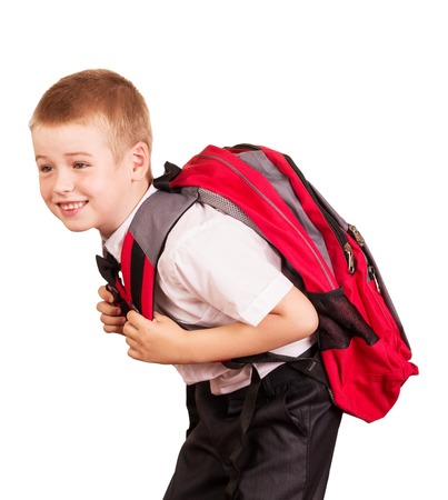 Lovely student with a heavy backpack isolated on white background.の写真素材