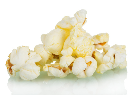 Pieces of salted popcorn isolated on white backgroundの写真素材