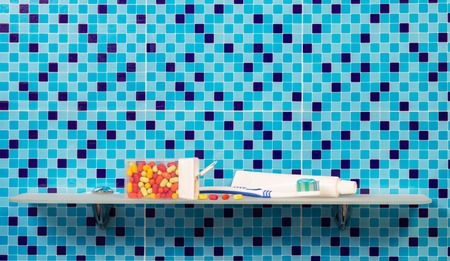 Accessories for the mouth on the shelf in the bathroomの写真素材