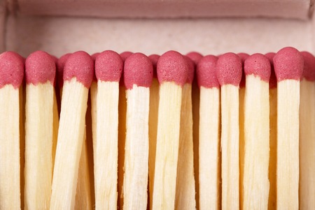 Matches against the backdrop of an open box closeup.の写真素材