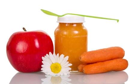 Carrot and apple puree baby isolated on white background.の写真素材