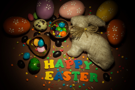 Inscription Happy Easter, Easter Bunny, colorful easter eggs, various pills and decorations for...