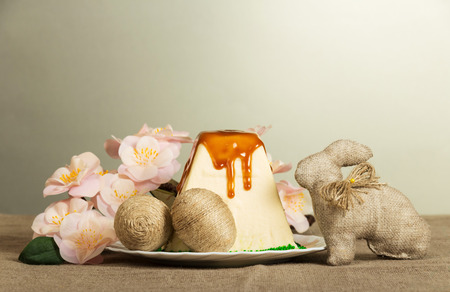 Easter eggs entwined string cheese and traditional Easter dessert Easter bunny and branch with...