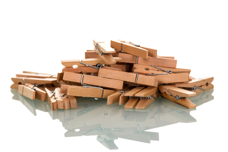 Pile of wooden clothespins isolated on white backgroundの写真素材