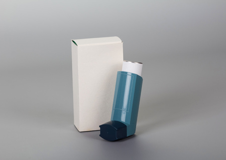 Device for inhalation with a dispenser isolated on gray background