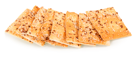Crispy biscuits with sunflower seeds, flax and sesame seeds isolated on white background.の写真素材