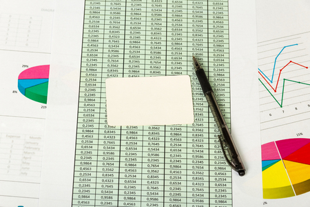 Blank card, pen, sheets of paper with accounts and charts. Background.の写真素材
